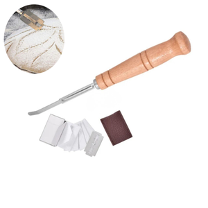 Bread lame dough scoring tool with wooden handle, replaceable razor blades, and leather storage sleeve for scoring sourdough and artisan bread before baking.