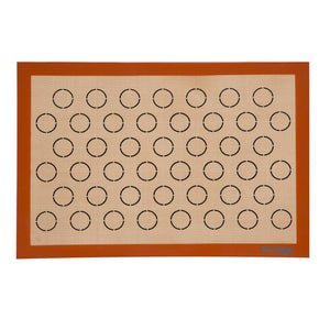 Reusable macaron baking mat with piping guides for evenly sized macaron shells